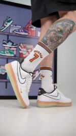 کتونی نایک ایرفورس1 سفید مشکی زیره نارنجی(Nike Air Force 1 Low White Black Orange Mini Swoosh Gradient Sole)